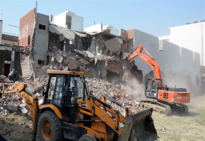 Baba's bulldozers arrived to raze the hotel of riot accused Rajeev Rana in Bareilly.